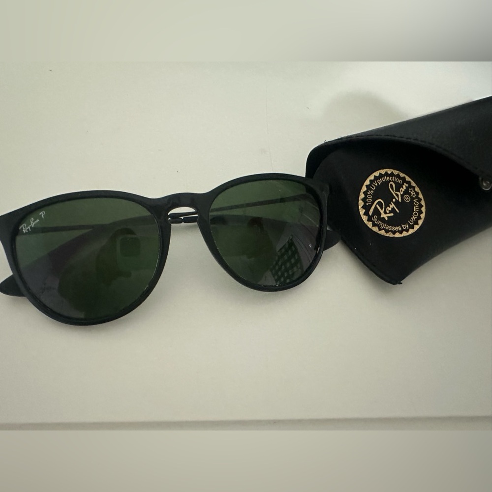 Black ray bans green tinted lens